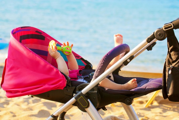 Baby in hired pram in Majorca