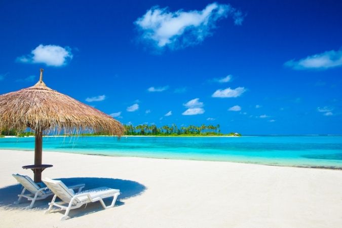 White sand beach and blue sea of the Maldives