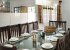 The smart contemporary kitchen cum dining room is a great asset for gu