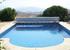 view of pool with mountains in background