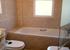 The family bathroom with a view towards the bath and window