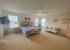 A huge master bedroom with double doors provides elegant comfort
