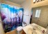 A grand en suite serves the second master bedroom
