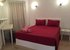 Bedroom with kingsize bed, 2 bedside cabinets, dresser, shelf & mirror