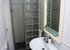 The bathrooms servicing bedrooms 2 and 3 are identical