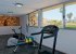 The lovely gym area with stunning views over the golf course and sea.