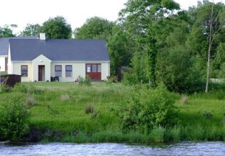 Cottage in Portinode, Northern Ireland: Cottage from water