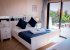 Master bedroom with sea views from the balcony, fitted wardrobes + a/c