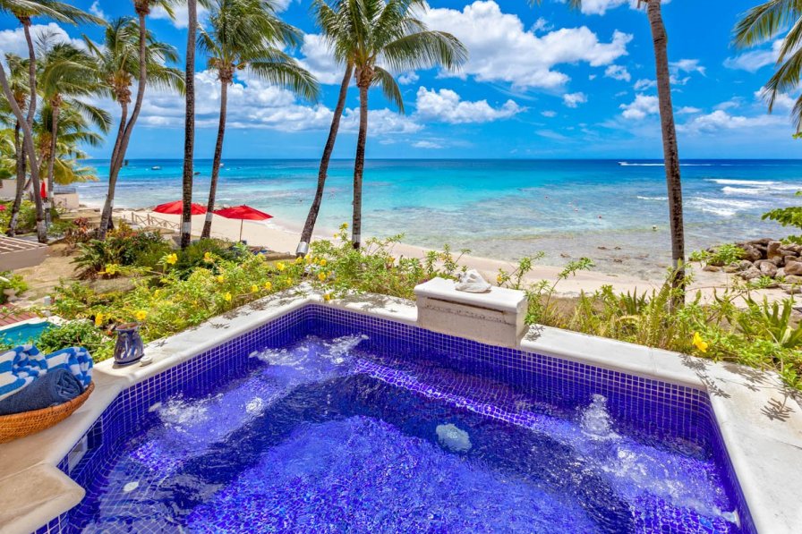 Villa in Holetown the private spa pool looking out onto the beach and ocean.