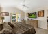 Master Bedroom w/ wall mounted TV and slider to pool deck 