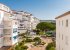 View from the balcony, overlooking gardens and pool