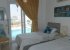 Downstairs twin bedroom with pool access, wardrobes, aircon