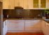 European kitchen with microwave, gas hob, convection oven, dishwasher.