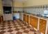 The downstairs kitchen: interior view, showing worktops & the barbecue