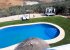 A view of the pool and garden from above.