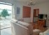 The living room: sofas, shuttered window, the door leads to bedroom 1.