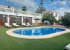 the pool area of Finca la Casilla, with the downstairs kitchen. 