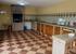 The donstairs kitchen: interior view, showing worktops.