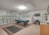 Games room with pool table and air hockey