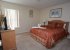 Queen-sized bed with TV