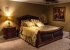 Master bedroom with Super King-size bed, ensuite bathroom, & TV
