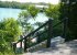 Stairway to lakeside fire pit, deck, & boat dock