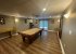 Games room with pool table, shuffleboard, game box, & drink cooler