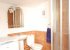 The second bathroom has a shower, toilet, and sink.