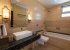 En-suite bathroom with bath tub