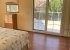 Top floor bedroom opening onto roof terrace