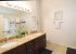 En suite with shower, bath, twin sinks, granite counters