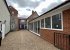 Driveway and front door; games room on the right