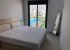 master bedroom with ensuite bathroom and garden/swimming pool view