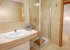 En-suite bathroom with shower, basin, bidet, toilet.