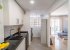 Kitchen with access to the living room.