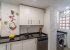Modern kitchen with all appliances.