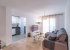 Living room, smart tv, leading to the kitchen.