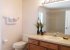 Family bathroom with tub/shower and door to the pool deck (alarm)