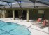 Beautiful pool with large shaded area and sunny pool deck, pool fence