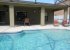 Beautiful pool with large shaded area and sunny pool deck, pool fence