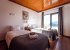 Cozy lake-view room with twin beds & a balcony for breathtaking vistas