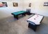 Fun games room with pool table and air hockey