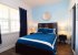 Bedroom 2 is a queen room with TV and ceiling fan