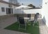 Rear patio area with outdoor furniture and gas barbecue
