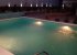 Pool view at night from pergola 2