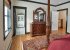 The master bedroom has an attached bathroom. 