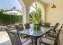 Dining area in covered terrace, next to the pool