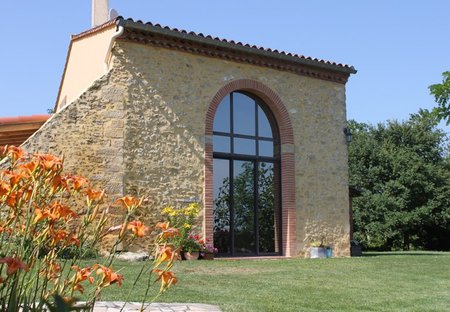 Farm House in Pech-Luna, the South of France: Front view with double height window looking towards..