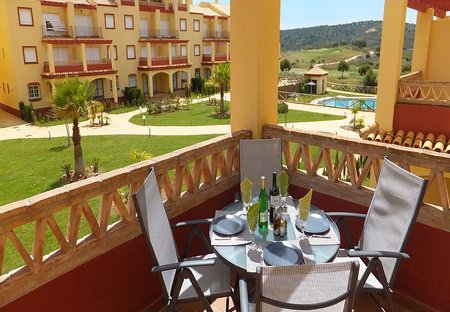Apartment in Ayamonte, Spain: Patio with view to pool and golf course