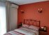 Double bedroom with patio doors to the corner balcony